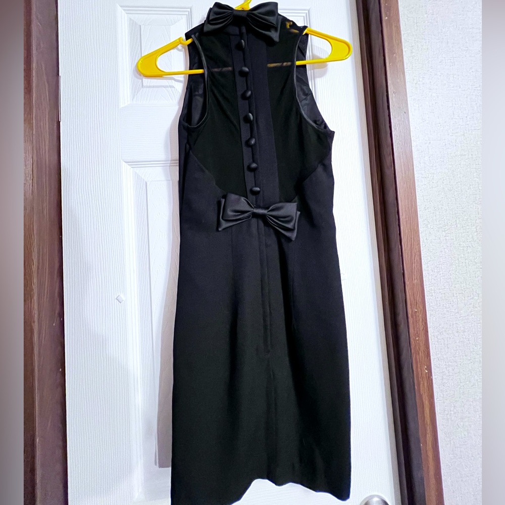 Super cute black dress, plain front with fun mesh back